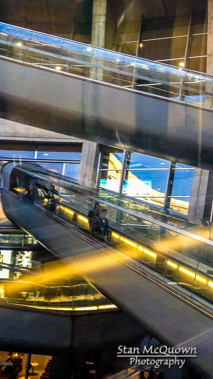 Very unique to the Paris CDG airport, crossing escalators in glass tubes!